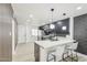 This updated kitchen features modern pendant lights, an island, and stainless appliances at 3002 N 32Nd St # 15, Phoenix, AZ 85018