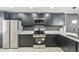 Updated kitchen boasts stainless appliances, dark cabinetry and bright countertops at 3002 N 32Nd St # 15, Phoenix, AZ 85018