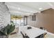 Bright living room features wood-look floors, a large picture window and modern decor at 3002 N 32Nd St # 15, Phoenix, AZ 85018
