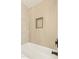 Bright shower with light wood-look vertical tile, niche, and black hardware at 3002 N 32Nd St # 15, Phoenix, AZ 85018