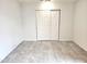 Bedroom with tile floors and a double sliding door closet at 3123 W Holly St, Phoenix, AZ 85009