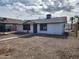 Well-maintained single-story home with a carport and easy desert landscaping, fenced for privacy at 3123 W Holly St, Phoenix, AZ 85009