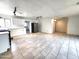 Bright kitchen features white cabinets, stainless steel appliances, and tile flooring at 3123 W Holly St, Phoenix, AZ 85009