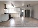 Bright kitchen features white cabinets, stainless steel appliances, and tile flooring at 3123 W Holly St, Phoenix, AZ 85009