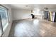 Spacious room featuring a kitchen with white cabinets, stainless steel appliances, and tile flooring at 3123 W Holly St, Phoenix, AZ 85009