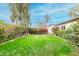 Private backyard with manicured lawn and mature landscaping offers a tranquil and secluded retreat at 3512 N Chambers Ct, Scottsdale, AZ 85251