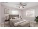 Cozy bedroom featuring neutral tones, plush bedding, and ample natural light from windows at 3512 N Chambers Ct, Scottsdale, AZ 85251