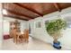 Dining area featuring a wood-paneled ceiling, tile floor, and space for a large table at 3512 N Chambers Ct, Scottsdale, AZ 85251