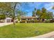 Charming single-story home with a well-manicured lawn and mature landscaping at 3512 N Chambers Ct, Scottsdale, AZ 85251