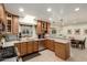 Kitchen with tile floors, stainless appliances, wooden cabinets and breakfast bar at 3512 N Chambers Ct, Scottsdale, AZ 85251