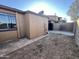 View of the backyard with partial concrete patio and privacy fence at 3646 N 67Th Ave # 83, Phoenix, AZ 85033