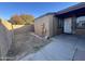 View of the backyard with partial concrete patio and privacy fence at 3646 N 67Th Ave # 83, Phoenix, AZ 85033