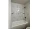 Renovated bathroom features white marble-look shower tile at 3646 N 67Th Ave # 83, Phoenix, AZ 85033
