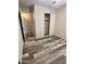 Bedroom with ensuite and closet, featuring wood-look floors at 3646 N 67Th Ave # 83, Phoenix, AZ 85033