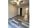 Bedroom with ceiling fan, wood-look floors, and walk-in closet at 3646 N 67Th Ave # 83, Phoenix, AZ 85033