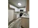 Updated kitchen features white cabinets, granite counters, and stainless steel appliances at 3646 N 67Th Ave # 83, Phoenix, AZ 85033