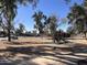 View of the neighborhood park with playground and mature trees at 3646 N 67Th Ave # 83, Phoenix, AZ 85033