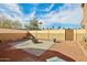 This low-maintenance backyard features a fire pit and potential for designing a personalized oasis at 41011 W Walker Way, Maricopa, AZ 85138