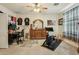 Bedroom with desk, workout equipment, and dresser; versatile space for work and recreation at 41011 W Walker Way, Maricopa, AZ 85138