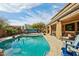 Enjoy the outdoors in this beautiful pool area with comfortable seating, perfect for soaking up the sun at 41011 W Walker Way, Maricopa, AZ 85138