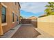 This expansive side yard offers flexibility for creating a dog run, garden, or even a putting green at 41011 W Walker Way, Maricopa, AZ 85138