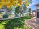 Beautiful backyard featuring a well-manicured lawn and lush landscaping at 4215 W Reddie Loop, Phoenix, AZ 85083