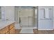 Modern bathroom showcasing a glass-enclosed shower and vanity with contemporary finishes at 4215 W Reddie Loop, Phoenix, AZ 85083