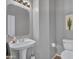 Well-lit powder room with a pedestal sink and neutral wall color at 4215 W Reddie Loop, Phoenix, AZ 85083