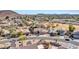 Aerial view of desert home featuring a tile roof, pool, desert landscaping, and convenient proximity to neighborhood amenities at 4215 W Reddie Loop, Phoenix, AZ 85083