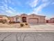 Charming home featuring a three-car garage, desert landscaping, and a well-maintained front yard at 4215 W Reddie Loop, Phoenix, AZ 85083