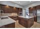 Gourmet kitchen features a center island, stainless appliances, and ample counter space at 4215 W Reddie Loop, Phoenix, AZ 85083