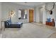 Inviting living room area with a comfortable seating area, hardwood floors, and natural light at 4215 W Reddie Loop, Phoenix, AZ 85083
