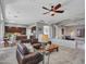 Open-concept living space connecting kitchen and lounge area, featuring modern design and comfortable seating at 4215 W Reddie Loop, Phoenix, AZ 85083