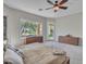 Spacious primary bedroom with large windows and modern furniture at 4215 W Reddie Loop, Phoenix, AZ 85083