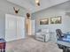 Office features a desk, a lounge chair, and a storage closet with sliding doors at 4215 W Reddie Loop, Phoenix, AZ 85083
