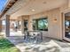 Covered patio with seating, perfect for outdoor dining and relaxation at 4215 W Reddie Loop, Phoenix, AZ 85083