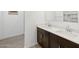 Modern bathroom featuring a stylish vanity, double sinks, and tile flooring at 4351 W Jeanette Ln, San Tan Valley, AZ 85144