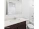 Modern bathroom features a single sink vanity with white countertop and a tub with shower at 4351 W Jeanette Ln, San Tan Valley, AZ 85144