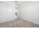 Bright bedroom featuring carpeted floors, white walls, and a closet with sliding doors at 4351 W Jeanette Ln, San Tan Valley, AZ 85144