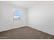 Clean, bright bedroom with neutral carpet, white walls, and a window with blinds at 4351 W Jeanette Ln, San Tan Valley, AZ 85144