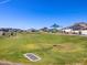Expansive community park with a playground, picnic area, and landscaped green space, perfect for families at 4351 W Jeanette Ln, San Tan Valley, AZ 85144