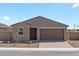 Charming single-story home featuring a gray exterior, landscaped front yard, and a two-car garage at 4351 W Jeanette Ln, San Tan Valley, AZ 85144