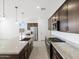 Kitchen view with stainless steel appliances, granite countertops, large island and dark wood cabinetry at 4351 W Jeanette Ln, San Tan Valley, AZ 85144