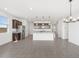 Open kitchen with stainless steel appliances and a large island with granite countertops at 4351 W Jeanette Ln, San Tan Valley, AZ 85144