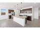 Spacious kitchen features stainless steel appliances, granite countertops, and a large kitchen island at 4351 W Jeanette Ln, San Tan Valley, AZ 85144