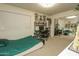 Cozy bedroom with large window, mirrored closet doors, and desk area at 4434 W Dahlia Dr, Glendale, AZ 85304