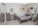 Inviting bedroom with a large bed, shelving, and window providing natural light at 4434 W Dahlia Dr, Glendale, AZ 85304