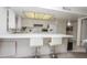 Bright kitchen with a large counter, white cabinetry, and modern appliances in a well lit space at 4434 W Dahlia Dr, Glendale, AZ 85304