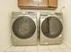 Efficient laundry room with modern Samsung washer and dryer units, and convenient storage cabinets at 4434 W Dahlia Dr, Glendale, AZ 85304