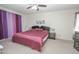 Serene main bedroom with a large bed, side tables, and decorative curtains at 4434 W Dahlia Dr, Glendale, AZ 85304